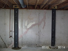 Dated picture of Foundation supports on a concrete wall