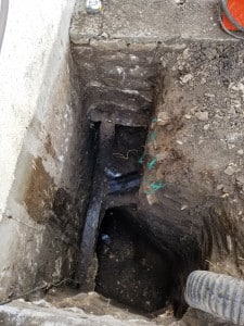 Deep pit next to foundation wall