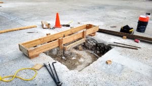 Wooden support over concrete hole