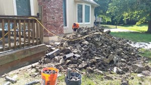 Pile of rubble outside house while fixing foundation