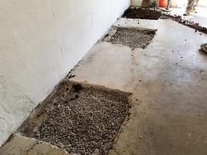 Foundation repair holes filled with gravel