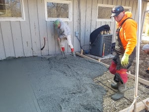 Pouring concrete onto a wood and rebar frame