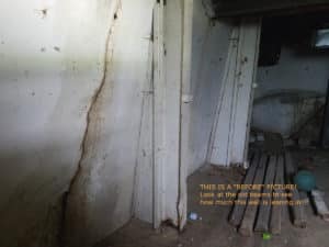 Foundation wall leaning heavily into basement