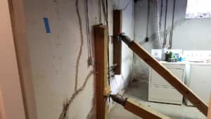 Adding wooden basement wall supports to wall