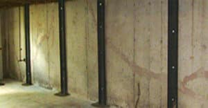 Foundation wall supports on wooden basement wall