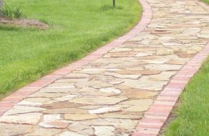 image of flagstone walkway with brick curbing