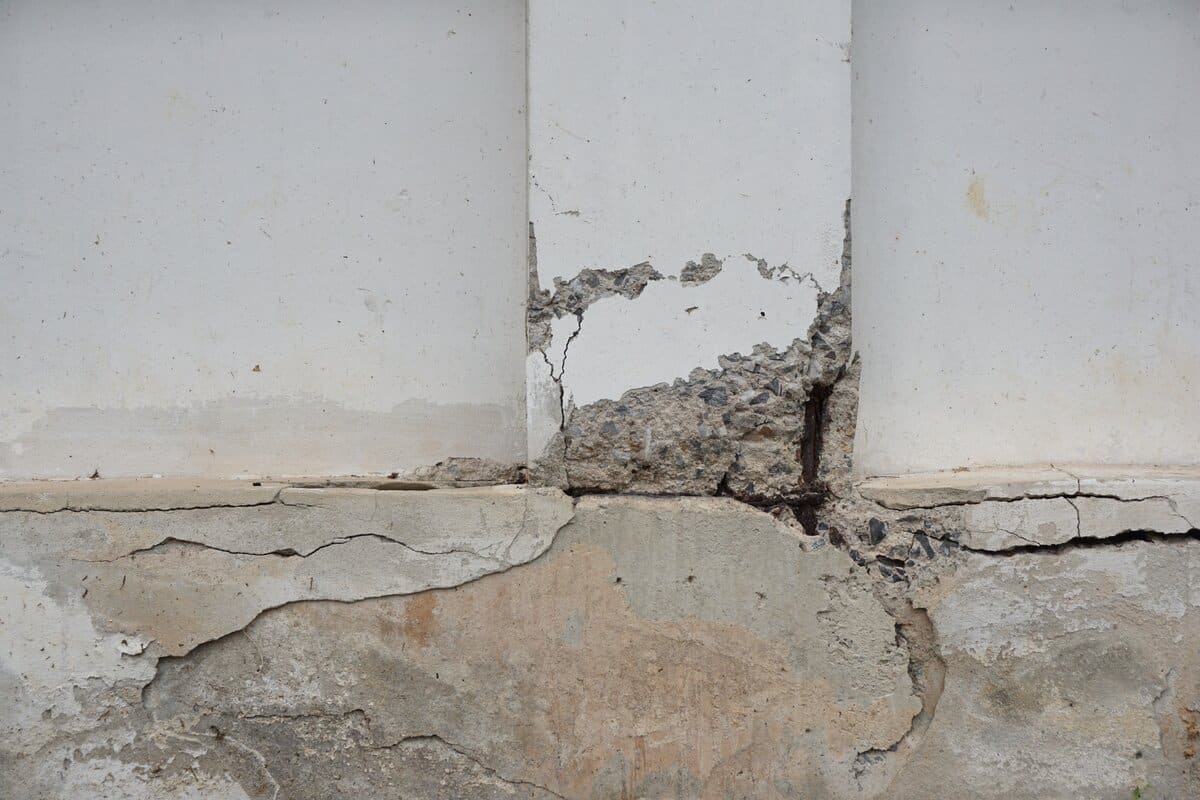 The reinforced concrete beam is damaged and cannot be used safely.